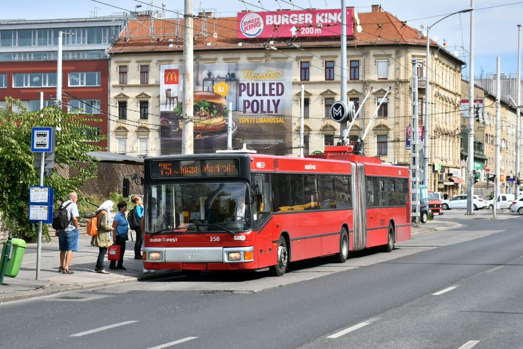 Former Eberswalde articulated trolleybus no. 037 of the Austrian type ÖAF Gräf & Stift NGE 152 M17 in Budapest/H with the car no. 358 at the stop „Puskás Ferenc Stadion M”